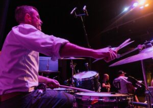 Principal hits the drums for charity