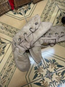 Unexpected treasure in donated boots, police search for rightful owners